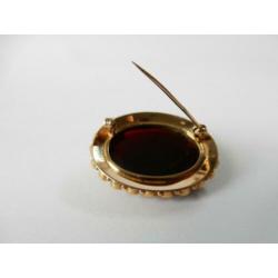 Gouden broche bezet met granaten