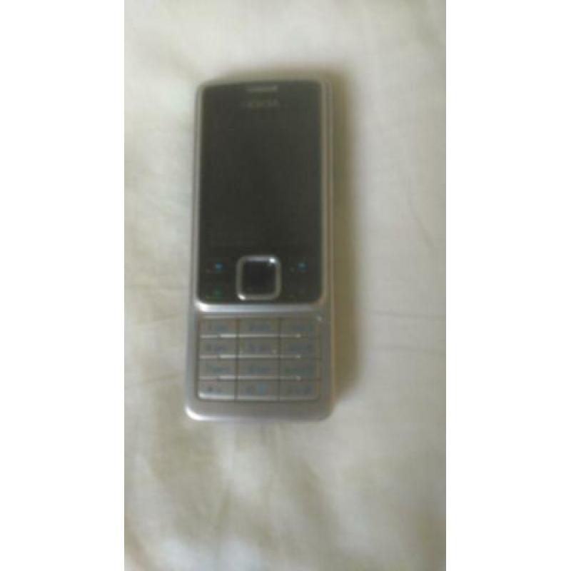 Originele NOKIA 6300 zilver/zwart met originele lader!