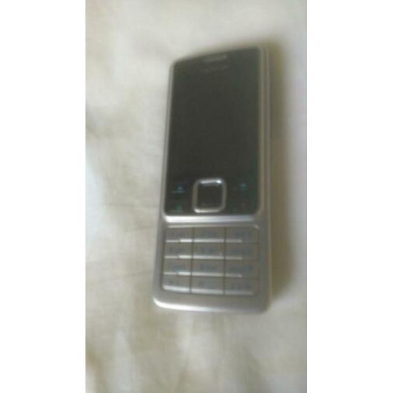 Originele NOKIA 6300 zilver/zwart met originele lader!