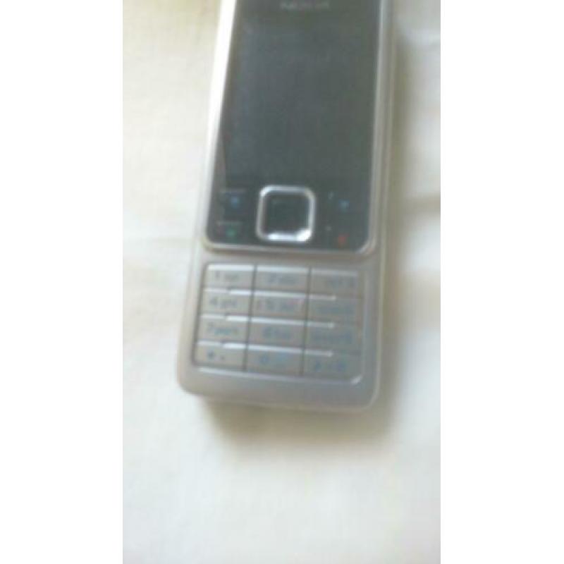 Originele NOKIA 6300 zilver/zwart met originele lader!